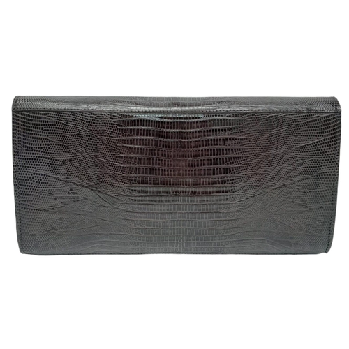 1441 - Chocolate Brown, Lizard Skin Clutch Bag.
Magnetic lock on front, this clutch offers loads of room. M... 