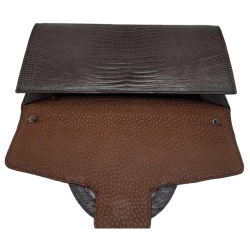 1441 - Chocolate Brown, Lizard Skin Clutch Bag.
Magnetic lock on front, this clutch offers loads of room. M... 