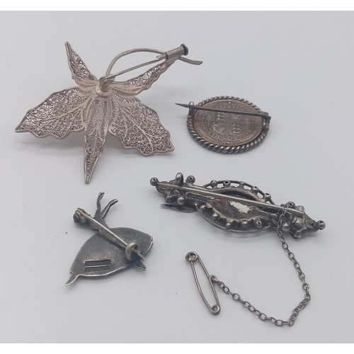 1658 - A collection of 3 vintage silver brooches: dancing ballerina, natural art, Victorian Jubilee shillin... 