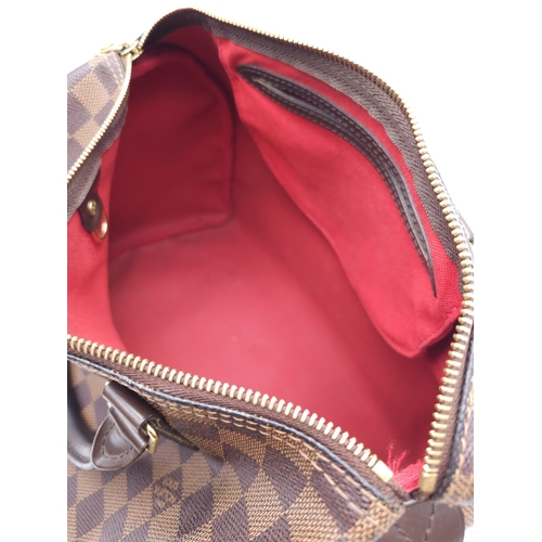 366 - A Louis Vuitton Speedy Damier Ebene Handbag. A leather exterior, with two rolled handles, gold toned... 