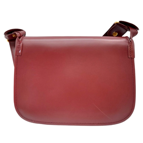 402 - Cartier Burgundy Shoulder Bag.
Quality soft leather exterior with rich suede accents, embossed C mot... 