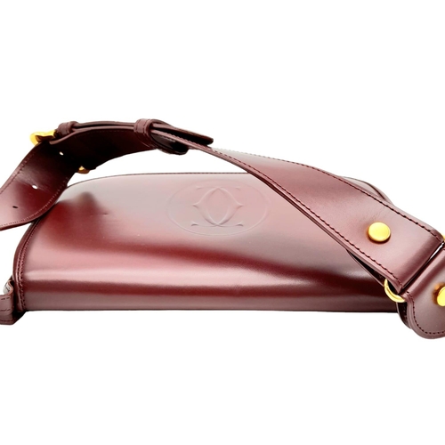 402 - Cartier Burgundy Shoulder Bag.
Quality soft leather exterior with rich suede accents, embossed C mot... 