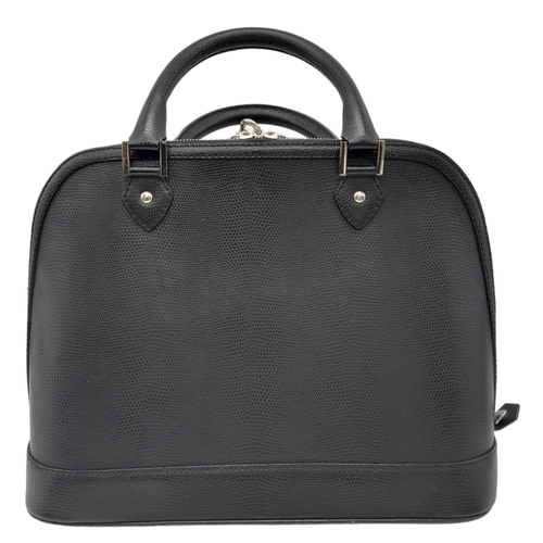 454 - An Aspinal Black Hepburn Bag. Lizard print leather exterior with rolled leather handles, silver tone... 