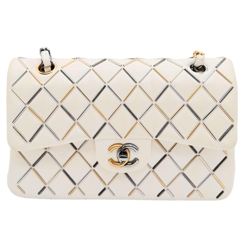 11 - Timeless Chanel Double Flap Bag.
Limited edition, it is part of the Metier d'Art collection year 201... 