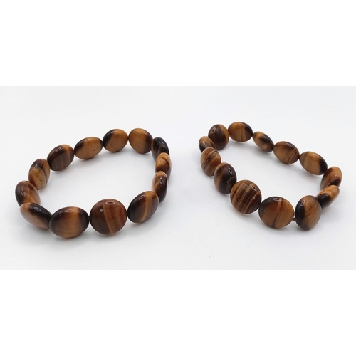 1283 - Two Ex Display Tigers Eye Stretch Fit Bracelets. 6cm Inner width at rest.
1.4cm Wide. Each weigh 32 ... 