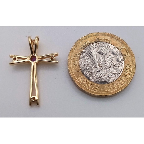 1411 - A 14K GOLD CROSS PENDANT WITH 4 DIAMONDS AND AN AMYTHIST.  2.1gms