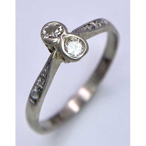 1461 - A VINTAGE 18K WHITE GOLD TWIN DIAMOND CROSSOVER ART DECO STYLE RING WITH DIAMOND SHOULDERS.  1.9gms ... 