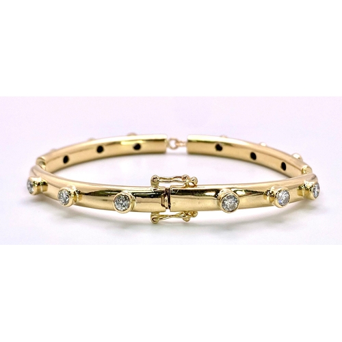 157 - An 18K Yellow Gold (Tested) Diamond Bar Tennis Bracelet. 1.2ctw of bright round cut diamonds. 17cm. ... 