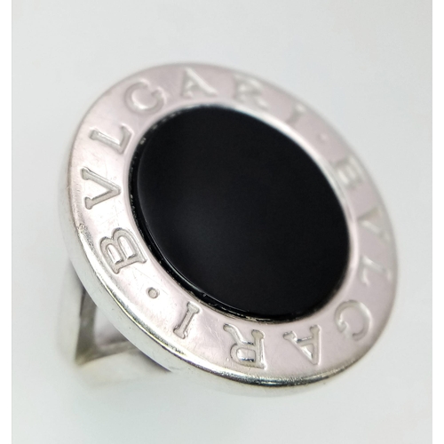 178 - A Bulgari White Gold and Onyx Ring. A stand-out piece in circular branded white gold and black onyx.... 