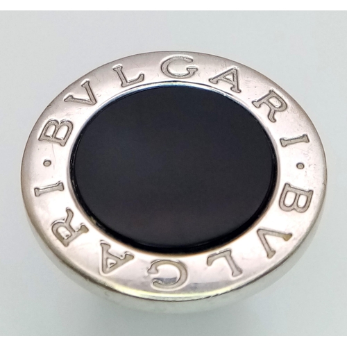 178 - A Bulgari White Gold and Onyx Ring. A stand-out piece in circular branded white gold and black onyx.... 