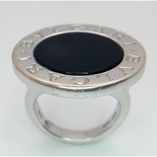 178 - A Bulgari White Gold and Onyx Ring. A stand-out piece in circular branded white gold and black onyx.... 