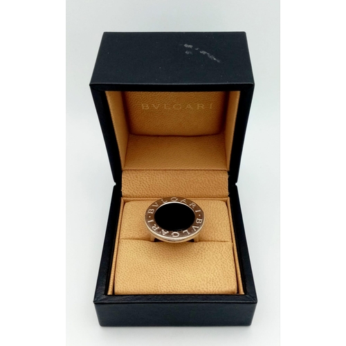 178 - A Bulgari White Gold and Onyx Ring. A stand-out piece in circular branded white gold and black onyx.... 