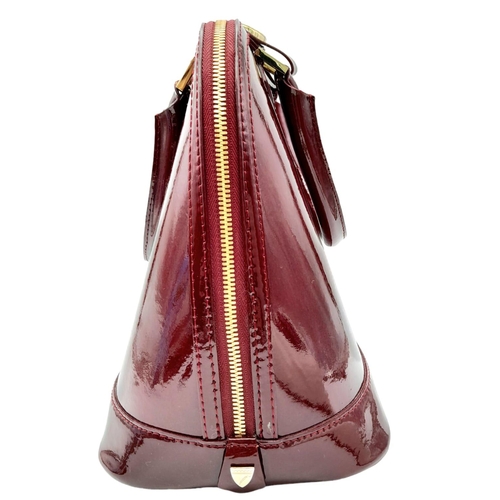 528 - An Aspinal Bright Burgundy Hepburn Bag. Patent leather exterior with rolled patent leather handles, ... 