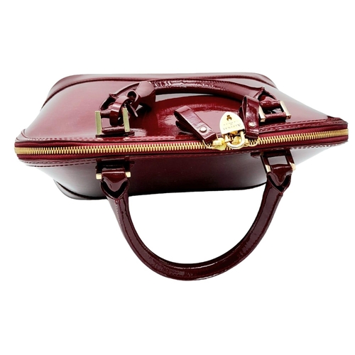 528 - An Aspinal Bright Burgundy Hepburn Bag. Patent leather exterior with rolled patent leather handles, ... 