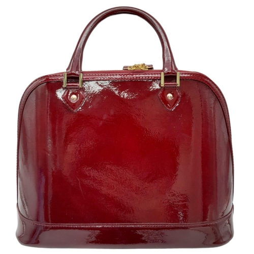 528 - An Aspinal Bright Burgundy Hepburn Bag. Patent leather exterior with rolled patent leather handles, ... 