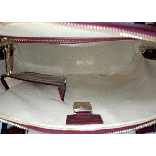 528 - An Aspinal Bright Burgundy Hepburn Bag. Patent leather exterior with rolled patent leather handles, ... 