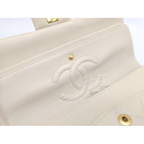 59 - Chanel Cream Maxi.
Double handled, quilted in diamond stitching and quality leather throughout. Gold... 