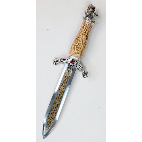 599 - An Excellent Condition, Gilt Decorated Gem Set, Celtic Design Dagger.
38cm Length. Comes In Wood and... 