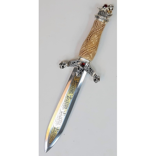 599 - An Excellent Condition, Gilt Decorated Gem Set, Celtic Design Dagger.
38cm Length. Comes In Wood and... 