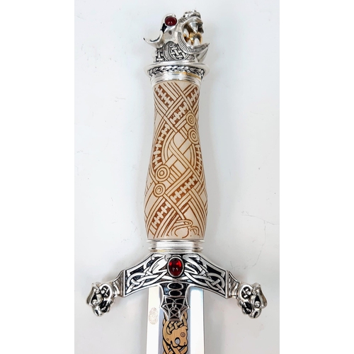 599 - An Excellent Condition, Gilt Decorated Gem Set, Celtic Design Dagger.
38cm Length. Comes In Wood and... 