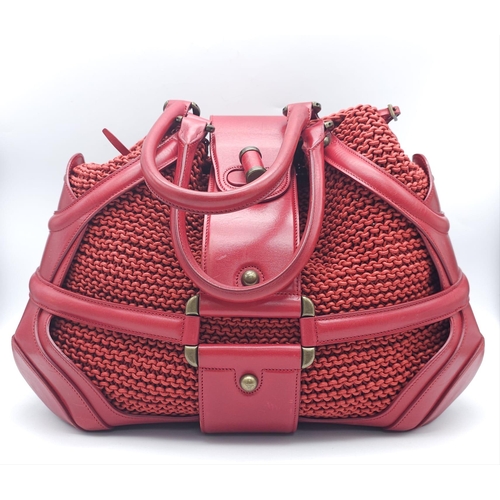 79 - Alexander McQueen Red Woven Coated Canvas and Leather Novak Satchel.
Versatile and functional, well-... 