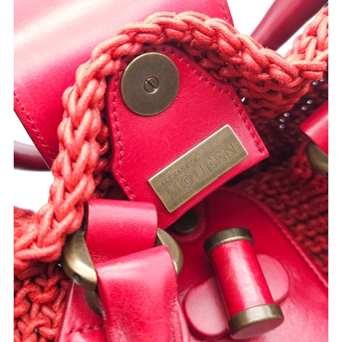 79 - Alexander McQueen Red Woven Coated Canvas and Leather Novak Satchel.
Versatile and functional, well-... 