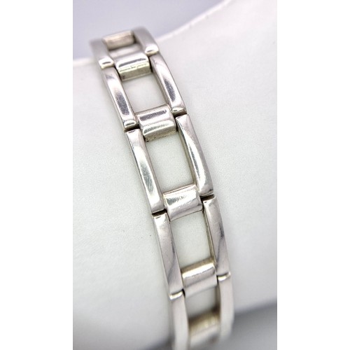 536 - A Men’s 2002 Hallmarked Silver Kerb Link Bracelet. 
19cm Length, 1.3cm. Width. 43.84 Grams.