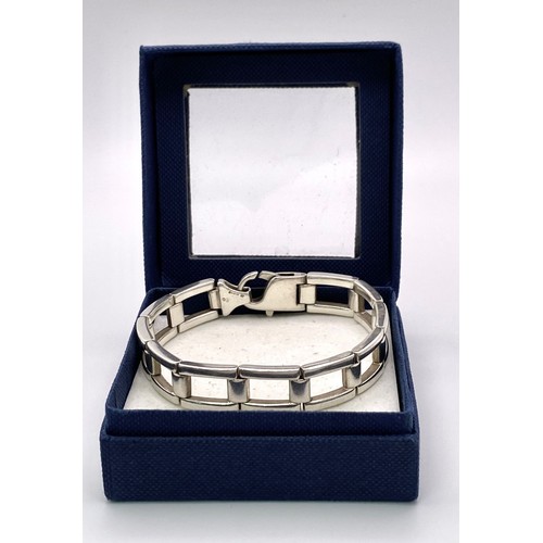 536 - A Men’s 2002 Hallmarked Silver Kerb Link Bracelet. 
19cm Length, 1.3cm. Width. 43.84 Grams.