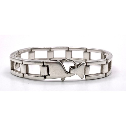 536 - A Men’s 2002 Hallmarked Silver Kerb Link Bracelet. 
19cm Length, 1.3cm. Width. 43.84 Grams.