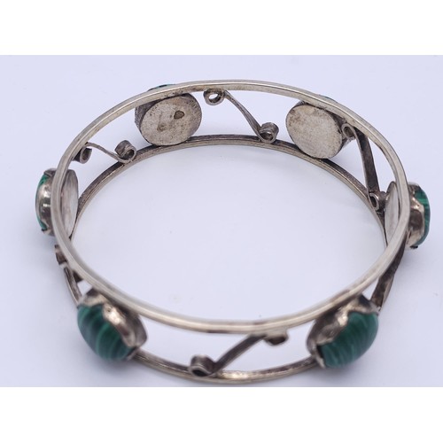 522 - A Vintage Continental Hallmarked Silver Malachite Cabochon Bracelet.
Bracelet Measures 6.5cm Inner W... 