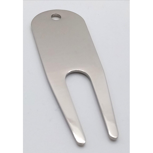 1032 - A Rolex Branded Golf Divot Tool. Repair that putting green divot in style. Engraved white metal. As ... 