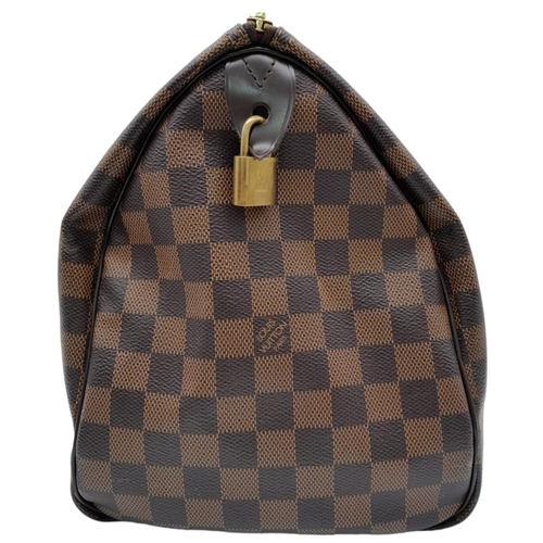 295 - A Louis Vuitton Damier Ebene Speedy 35 Bag. Leather exterior with two rolled leather handles, gold t... 