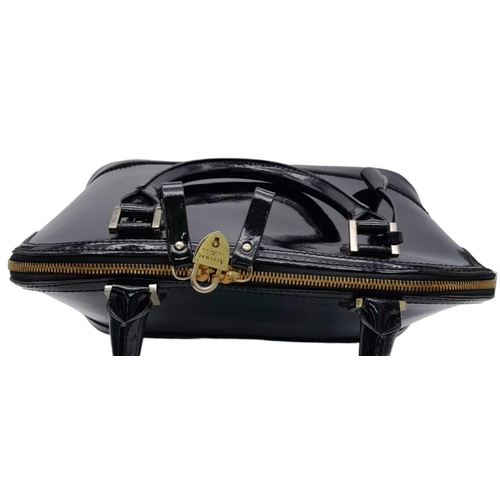 430 - An Aspinal Black Hepburn Bag. Patent leather exterior with rolled leather handles, gold toned hardwa... 