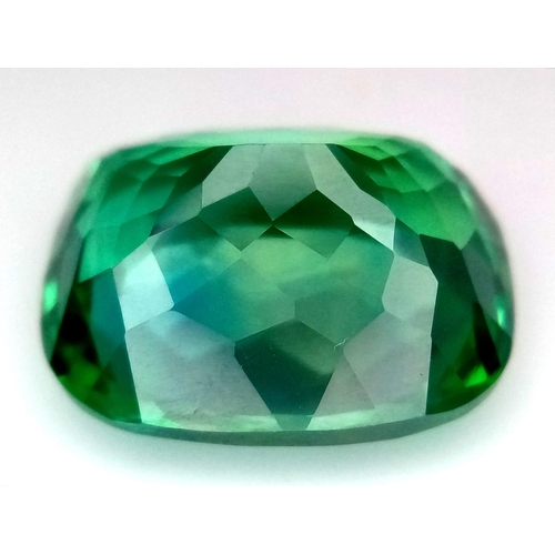 818 - A 23ct Beautiful Blue/Green Apatite Gemstone. Rectangular cut with a trillion base. Well faceted. No... 