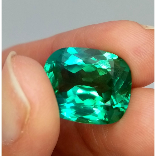 818 - A 23ct Beautiful Blue/Green Apatite Gemstone. Rectangular cut with a trillion base. Well faceted. No... 