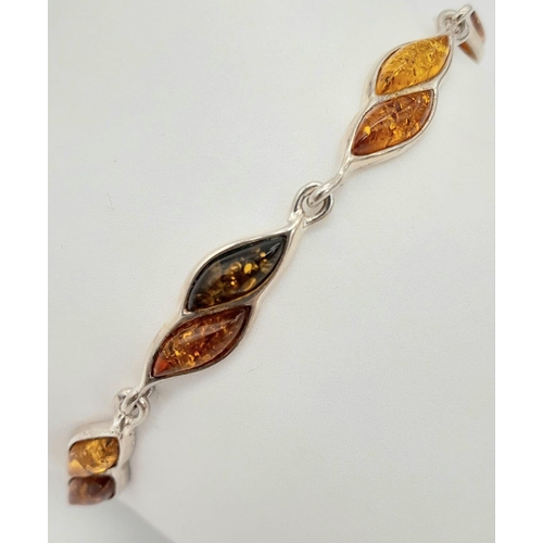 1029 - Sterling Silver Amber Set Tennis Bracelet 19.5cm Length. Set with three colour marquise cut amber. G... 