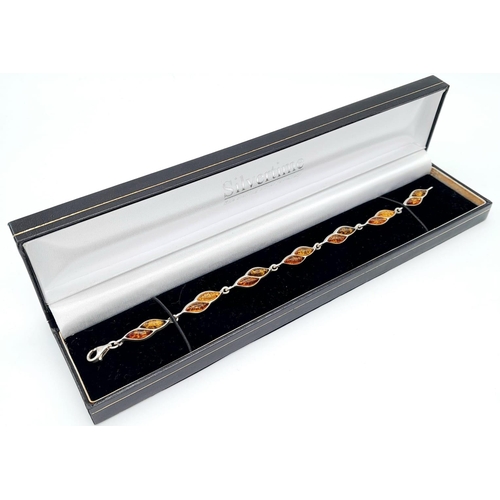 1029 - Sterling Silver Amber Set Tennis Bracelet 19.5cm Length. Set with three colour marquise cut amber. G... 