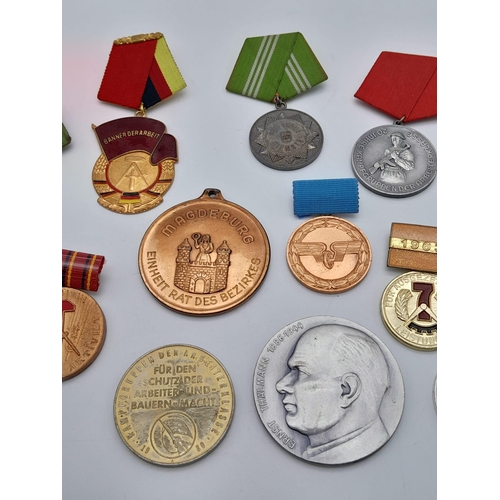 1165 - A collection of former East German Medals and Medallions.