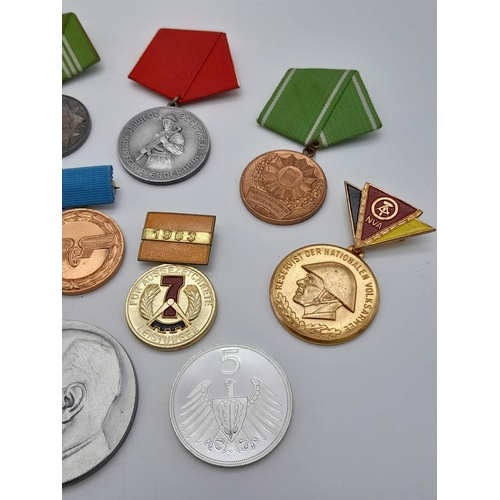 1165 - A collection of former East German Medals and Medallions.