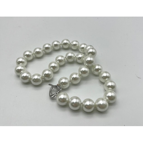 1265 - A Large White Beaded South Sea Pearl Shell Necklace. 14mm beads. Heart clasp. 42cm necklace length.