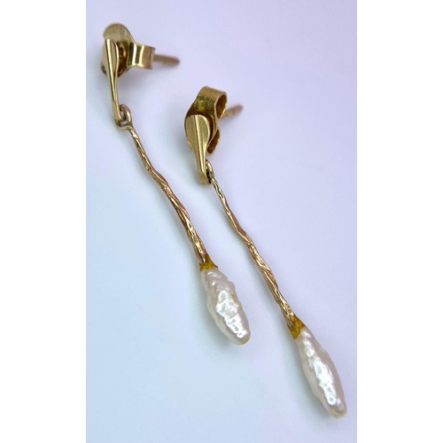 1325 - An Antique Set of 9K Gold and Small Baroque Pearl Jewellery. A safety pin brooch and pair of drop ea... 