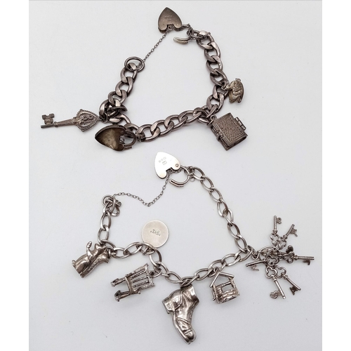 1339 - 2X vintage sterling silver charm bracelets with multiple charms such as Holly Bible, padlocks, squir... 