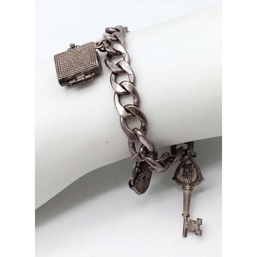 1339 - 2X vintage sterling silver charm bracelets with multiple charms such as Holly Bible, padlocks, squir... 