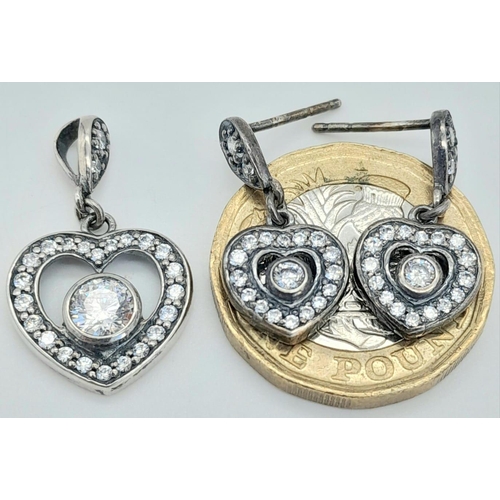 1530 - A matching set of fancy 925 silver stone set with heart shape decoration jewellery: A pendant, a pai... 