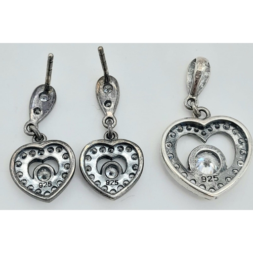 1530 - A matching set of fancy 925 silver stone set with heart shape decoration jewellery: A pendant, a pai... 