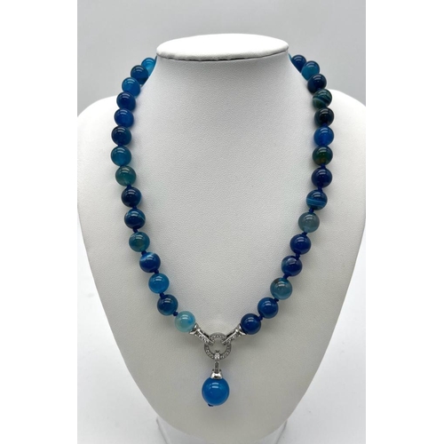 1657 - A Captivating Blue Stripe Agate Bead Necklace with Drop Pendant. 10mm agate beads. Decorative silver... 