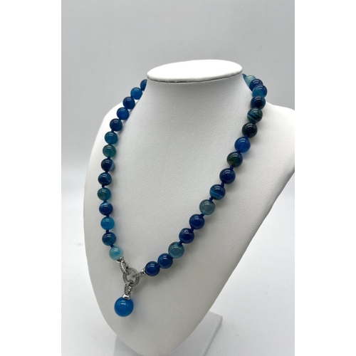 1657 - A Captivating Blue Stripe Agate Bead Necklace with Drop Pendant. 10mm agate beads. Decorative silver... 