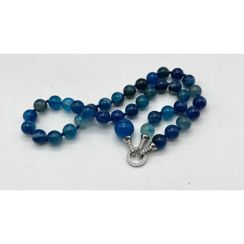 1657 - A Captivating Blue Stripe Agate Bead Necklace with Drop Pendant. 10mm agate beads. Decorative silver... 