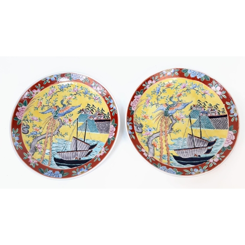 1785 - A pair of large, wonderful Chinese Famille Jaune enamelled Plates. Depicting boats, houses and phoen... 