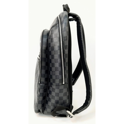 267 - A Louis Vuitton Damier Graphite Michael Backpack. Leather and canvas exterior with top handle, adjus... 